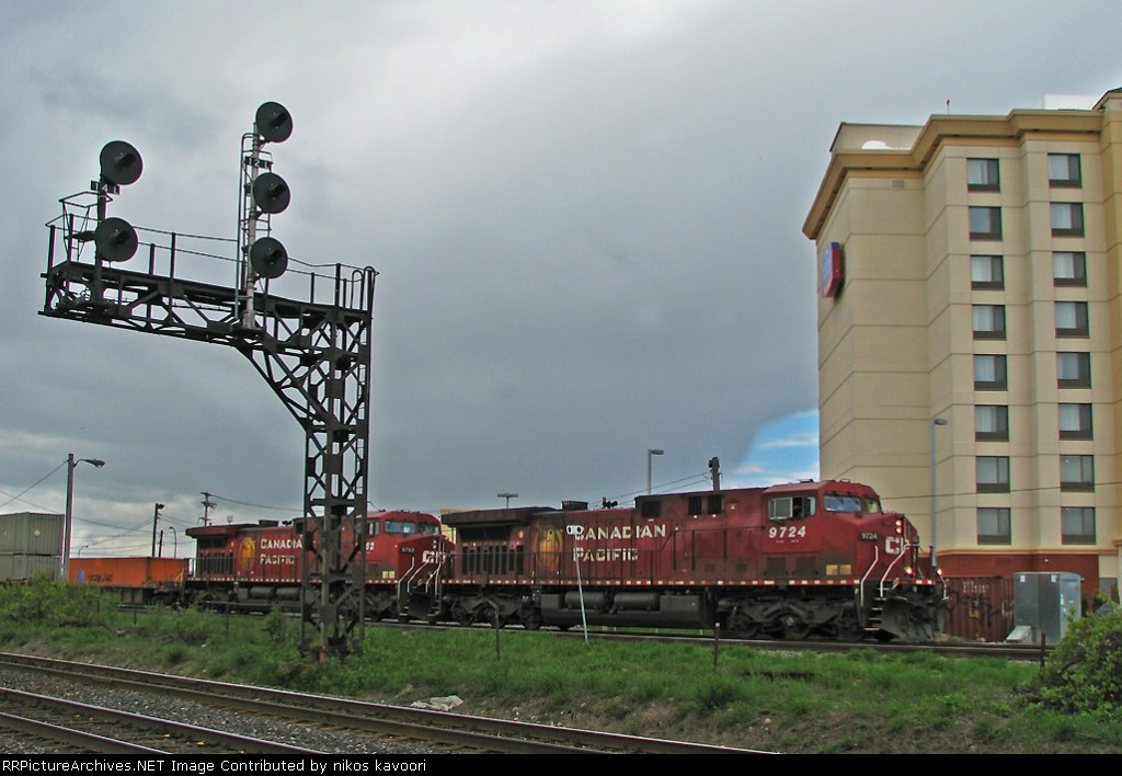 CP 9724 leads a stack train through Dorval under overcast skys.